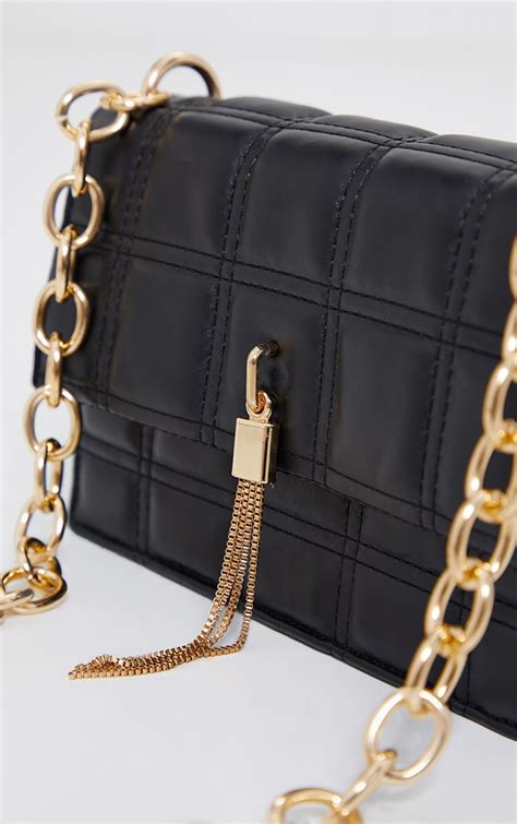 white bag with gold chain|black bag with gold hardware.